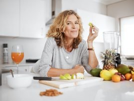 fruits-are-natures-candy-shot-of-a-woman-preparin-2022-09-14-00-10-56-MMRVYKX.jpg